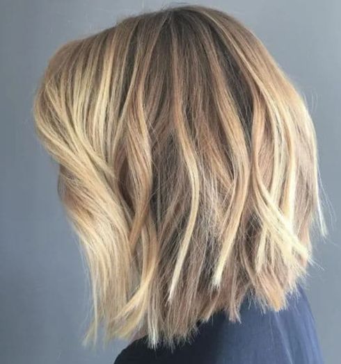 Can I add extensions to my layered hair for more length and volume?