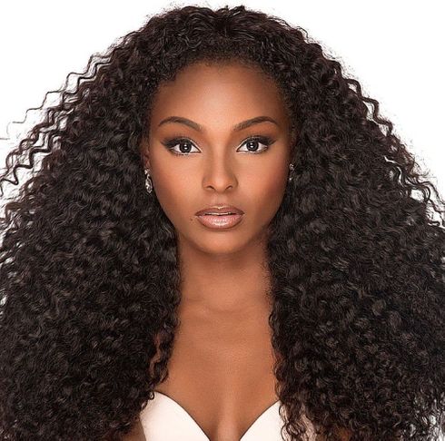 Center parted long curly hair for black women
