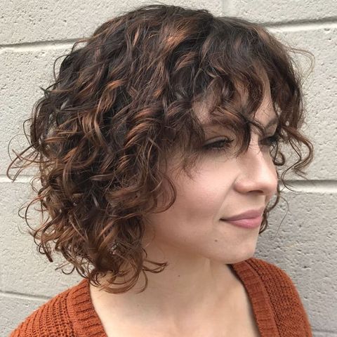 Balayage curly short hair with bangs for women in 2021-2022