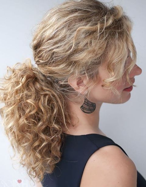 Ponytail curly hairstyle with bangs for women in 2021-2022