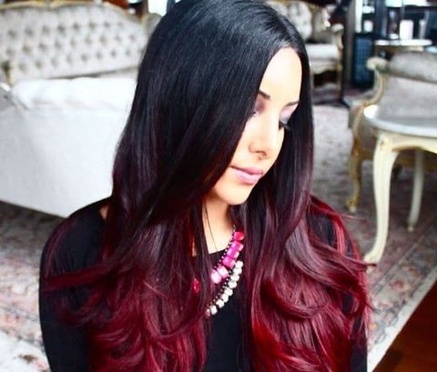 Center parted long hair with red ombre hair color