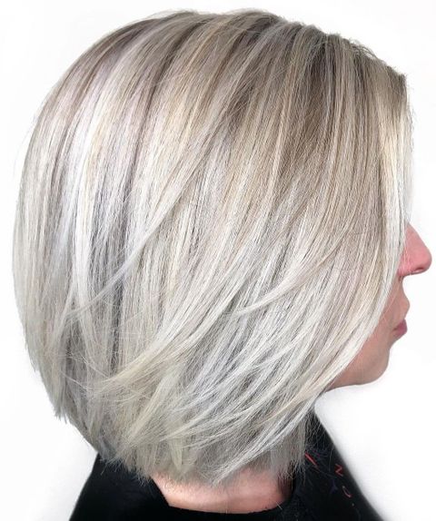 Icy blonde color mid-length hairstyle with layers 