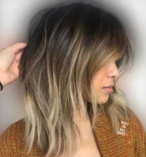 Shaggy long bob with blonde balayage