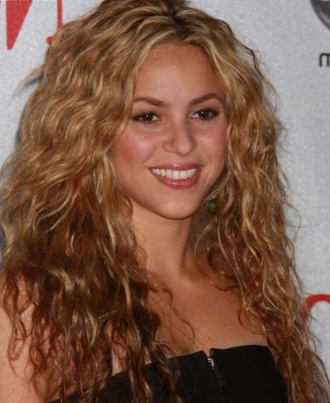Shakira's golden blonde curly long hair 2021-2022