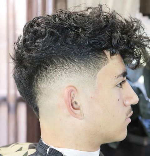 Natural curly mohawk haircut for men in 2021-2022