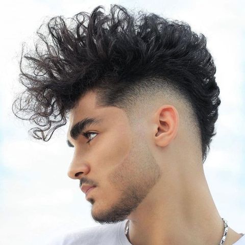 Voluminous curly mohawk haircut for men in 2021-2022