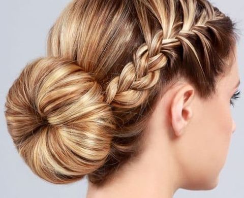 Low bun style with side braids for women in 2021-2022
