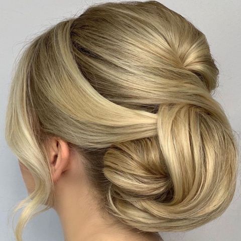 Low bun with bangs for prom in 2021-2022