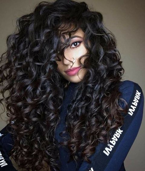 Textured long curly hairstyle for women in 2021-2022
