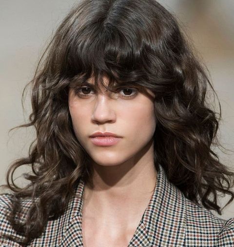 Shoulder length curly hair with bangs for women in 2021-2022