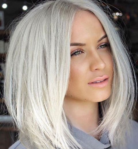 Center parted platinum blonde color in 2021-2022