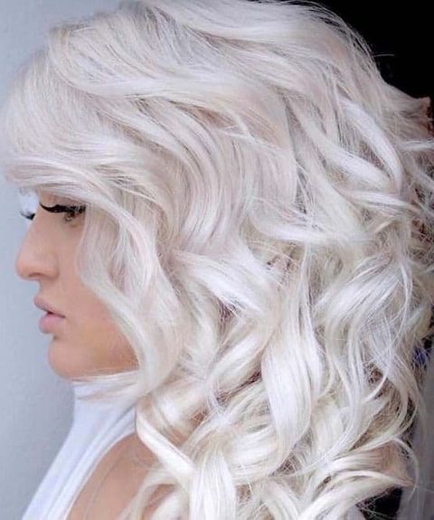 Curly shoulder length platinum blonde hair in 2021-2022