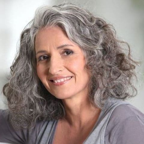 Grey balayage medium length curly hair for women over 60 in 2021-2022