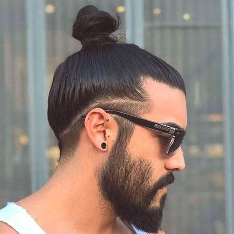 High bun hairstyle with undercut for men in 2021-2022