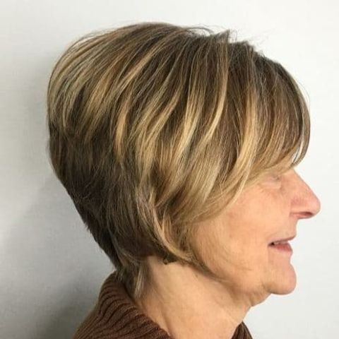 Angled layered short hair with bangs for women over 70 in 2021-2022