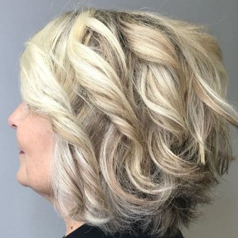 Curly short bob haircut for older women over 55 in 2021-2022