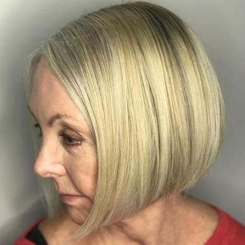 Blonde color layered bob haircut for women over 60 in 2021-2022