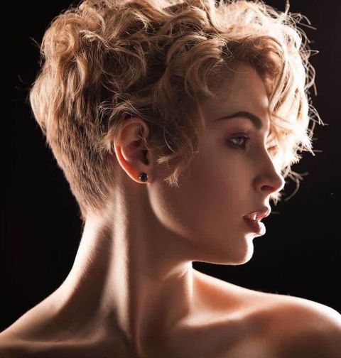 Blonde color curly pixie cut with bangs in 2021-2022