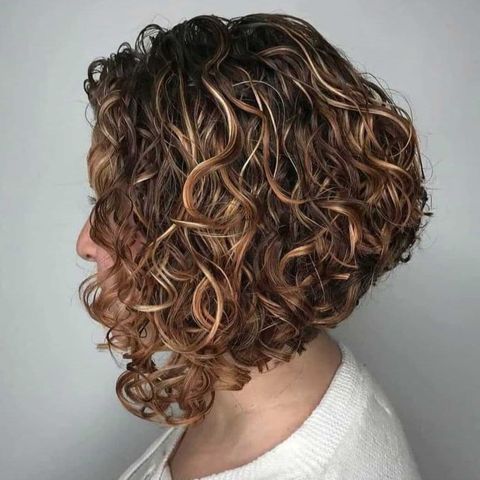 Angled curly short haircut