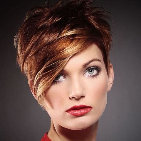 Layered short haircut with long bangs