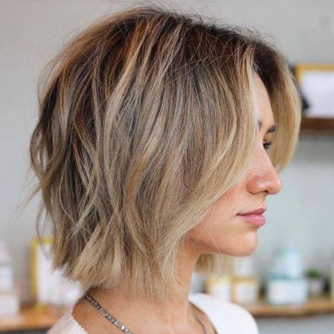 Center parted wavy bob cut