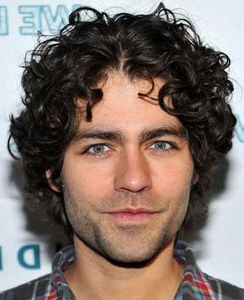 Center parted curly haircut for men