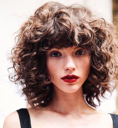 Curly bob haircut with bangs