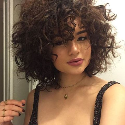 Curly short bob for round face