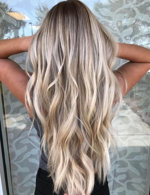 Very long blonde balayage hair style