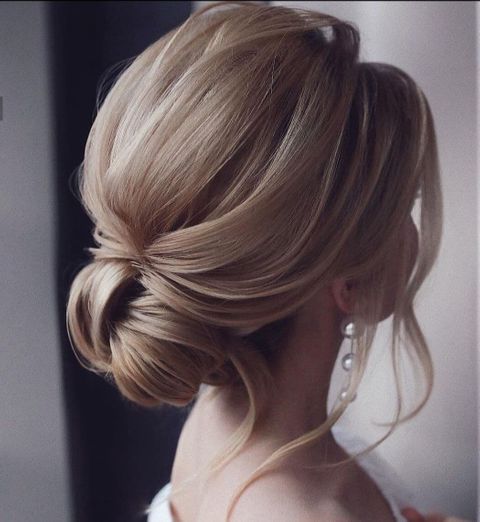 Golden blonde color low bun hair for wedding