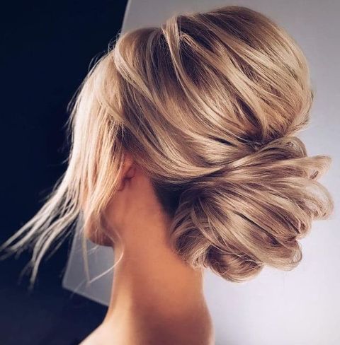 Messy low bun with bangs