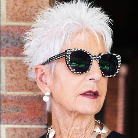 Spiky short haircut for women over 60 with glasses