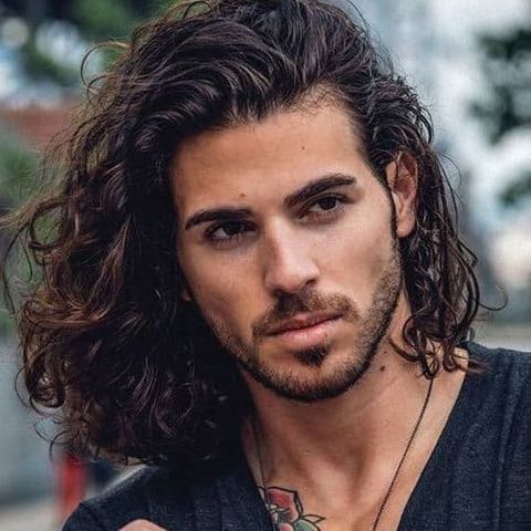 Wavy shoulder length curly hairstyle for men
