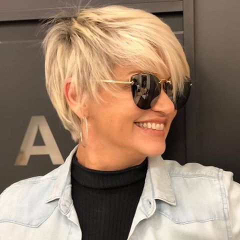 Cool blonde layered pixie haircut