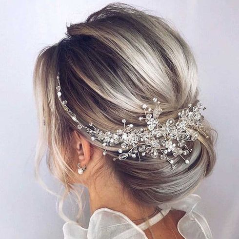 Blonde balayage low bun for wedding