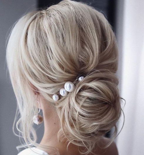 Blonde color bun hair with bangs