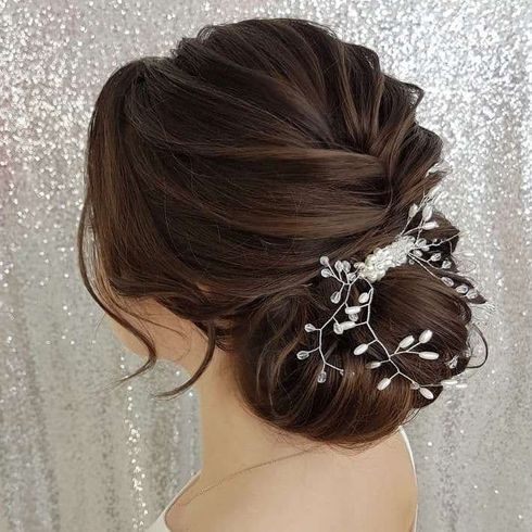 Cool low bun hair for wedding 