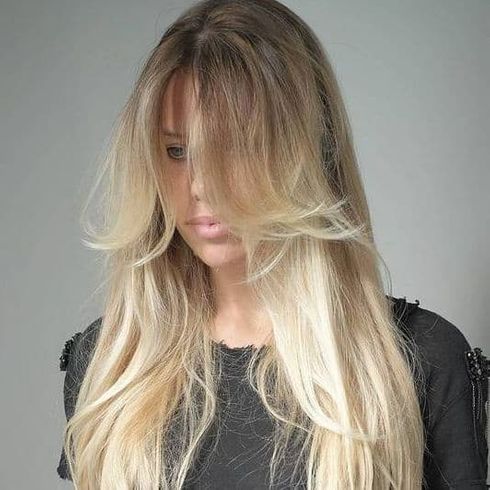 Blonde ombre layered long hair with bangs