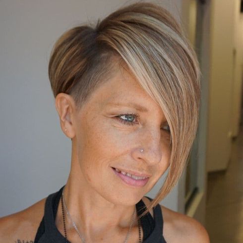 Undercut asymmetrical short hair with long bangs for women over 60