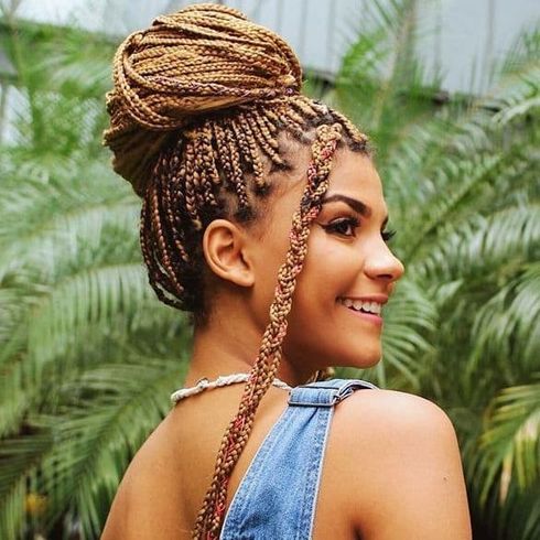 High bun ghana braids with long bangs