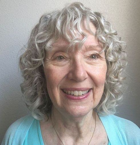 Blonde shoulder length curly hair over 70