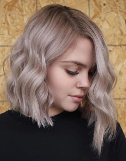 Blonde hair color asymmetrical short bob haircuts