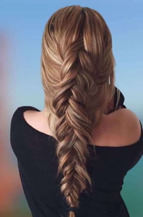 Voluminous fishtail braids for long hair