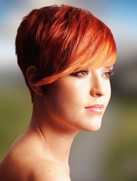 Red hair color pixie haircut with long bags