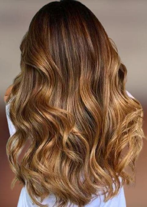 Long wavy hair with caramel highlights