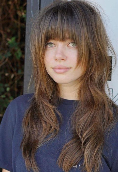 Wavy long layered haircut with bangs 2021-2022