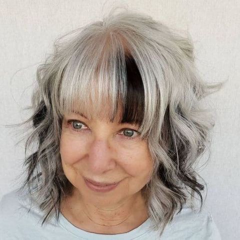 Curly shoulder length hair with bangs for women over 60 in 2021-2022