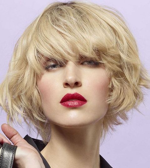 Blonde short layered bob with bangs