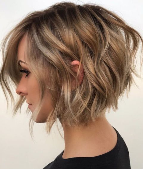 Soft wavy brown balayage layered bob with bangs