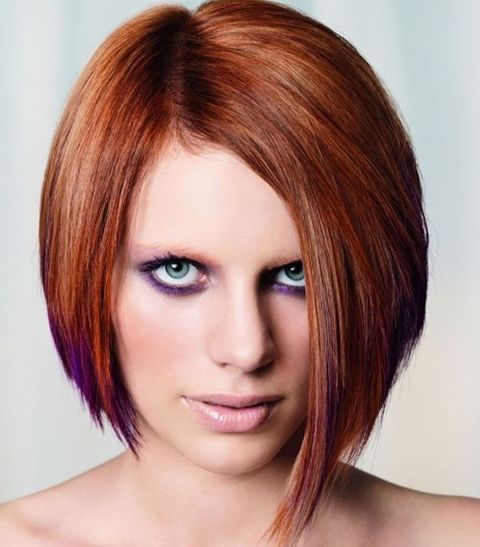 Center parted red asymmetrical bob haircut